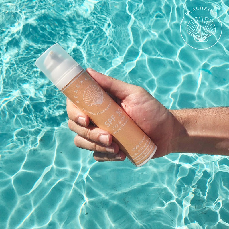 BEACHKIND Natural SunScreen SPF 30, 100ml by the pool in human hand