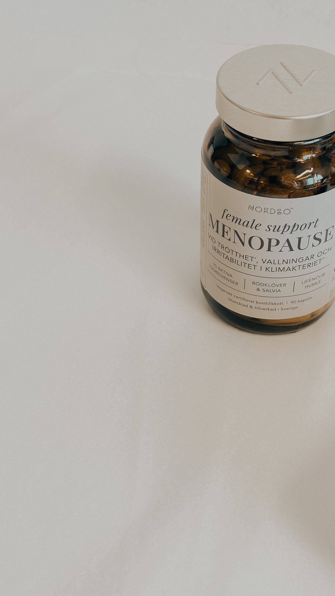 NORBOD female tuki menopausiin kapselit PURELA, 90 kappaletta, lähikuva kapselien pakkauksesta ja labelista.